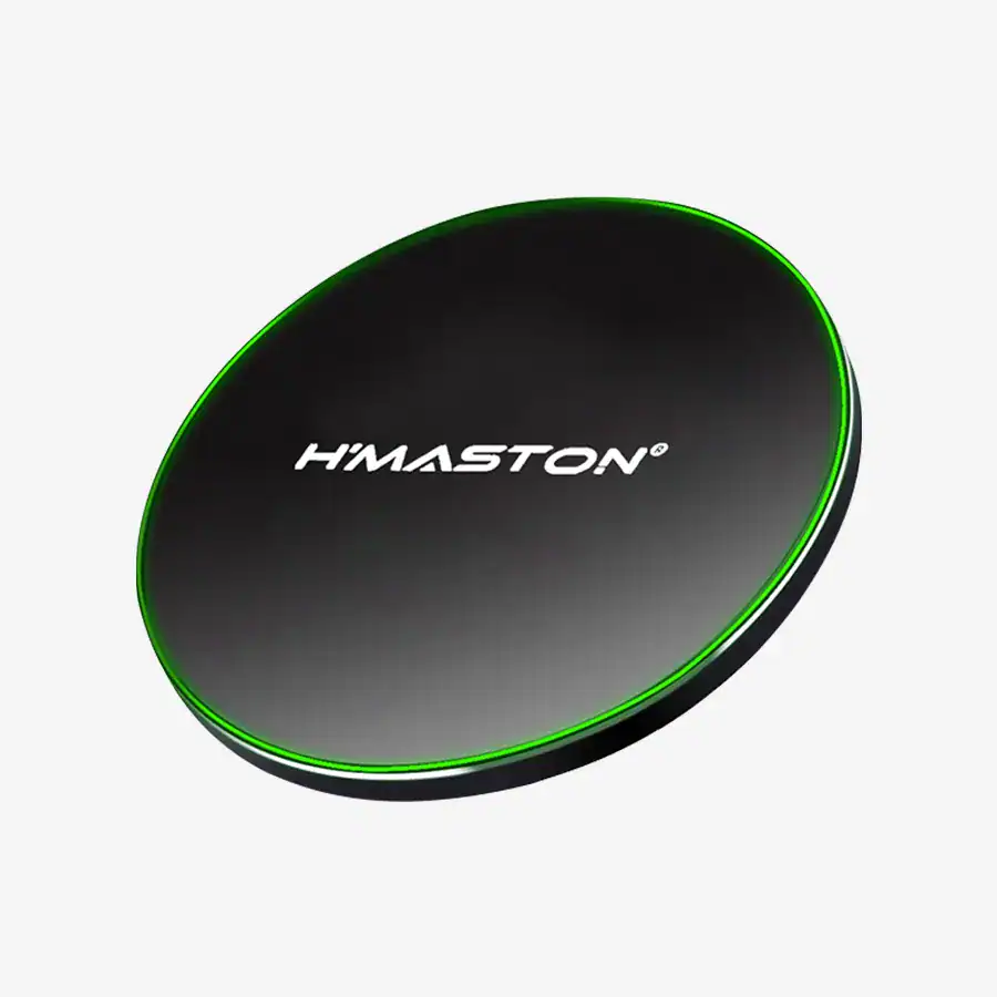 Alto texto: Carregador wireless H'Maston compacto e moderno com iluminação verde, ideal para carregar dispositivos móveis com praticidade e estilo.