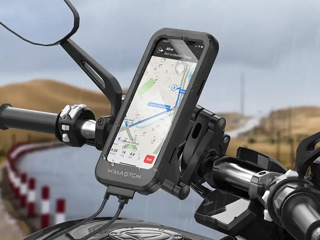 Navegador GPS para motocicletas com suporte robusto, ideal para aventuras ao ar livre e trilhas em terrenos variados. Compatível com smartphones, proporciona segurança e praticidade durante viagens.