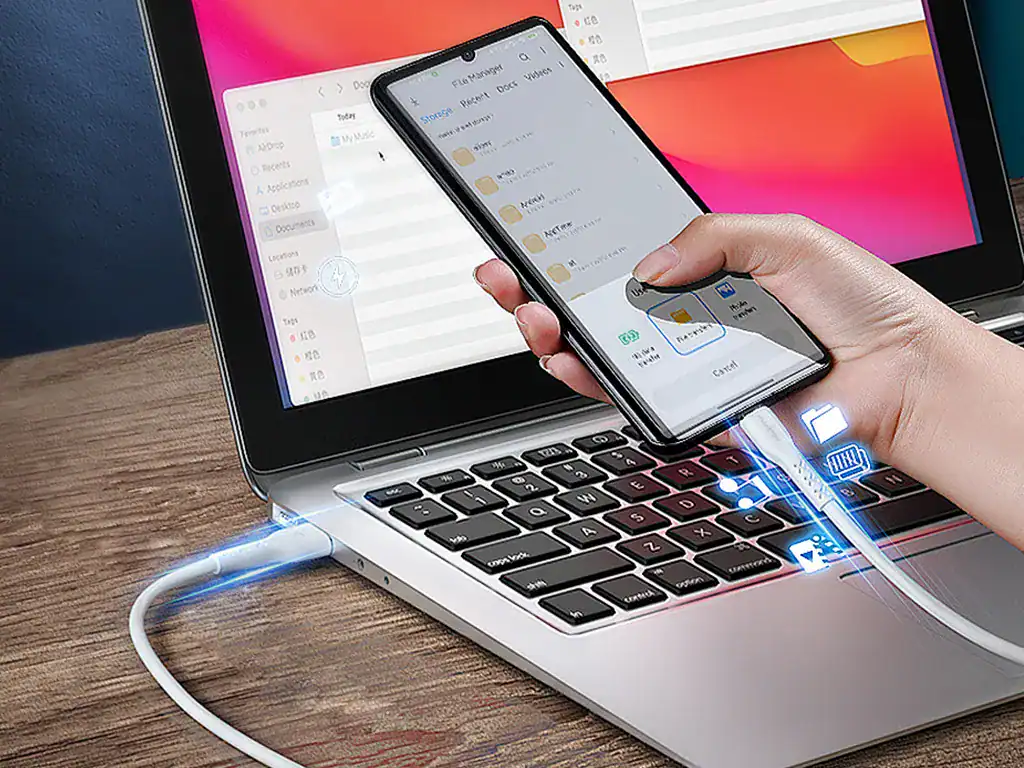 Transferência de arquivos entre celular e laptop, tecnologia de conectividade, compartilhamento digital, dispositivos eletrônicos, comunicação rápida, solução para armazenamento e troca de dados.